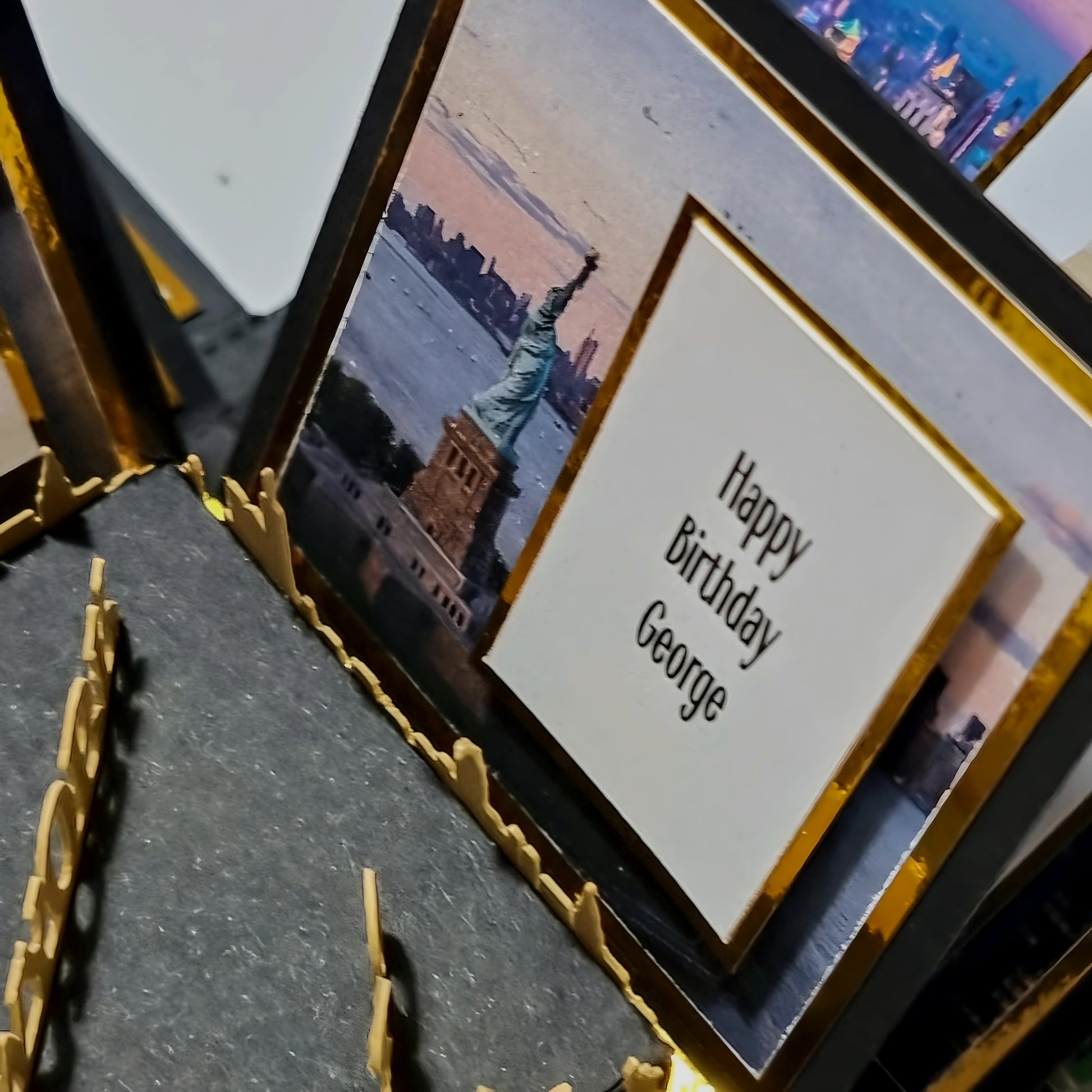 New York - Black & Gold - Surprise Special Occasion | Celebration Trip Reveal Explosion Box featuring Statue of Liberty-themed cards, highlighting iconic architecture and event details for a special New York surprise trip.