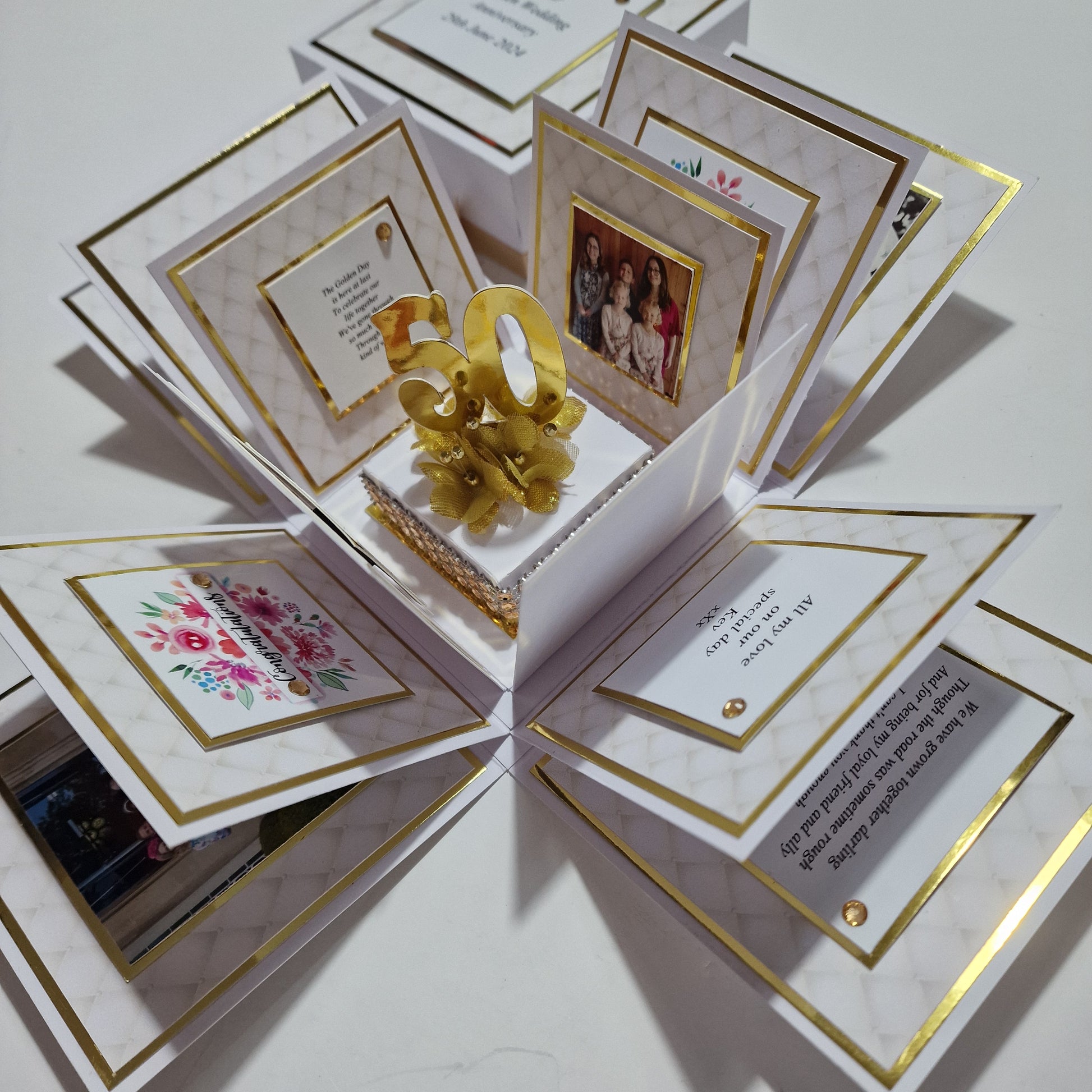 Golden Wedding Anniversary Exploding Box with white base, gold accents, and customizable panels featuring messages and space for photos, celebrating 50 years of love and commitment.