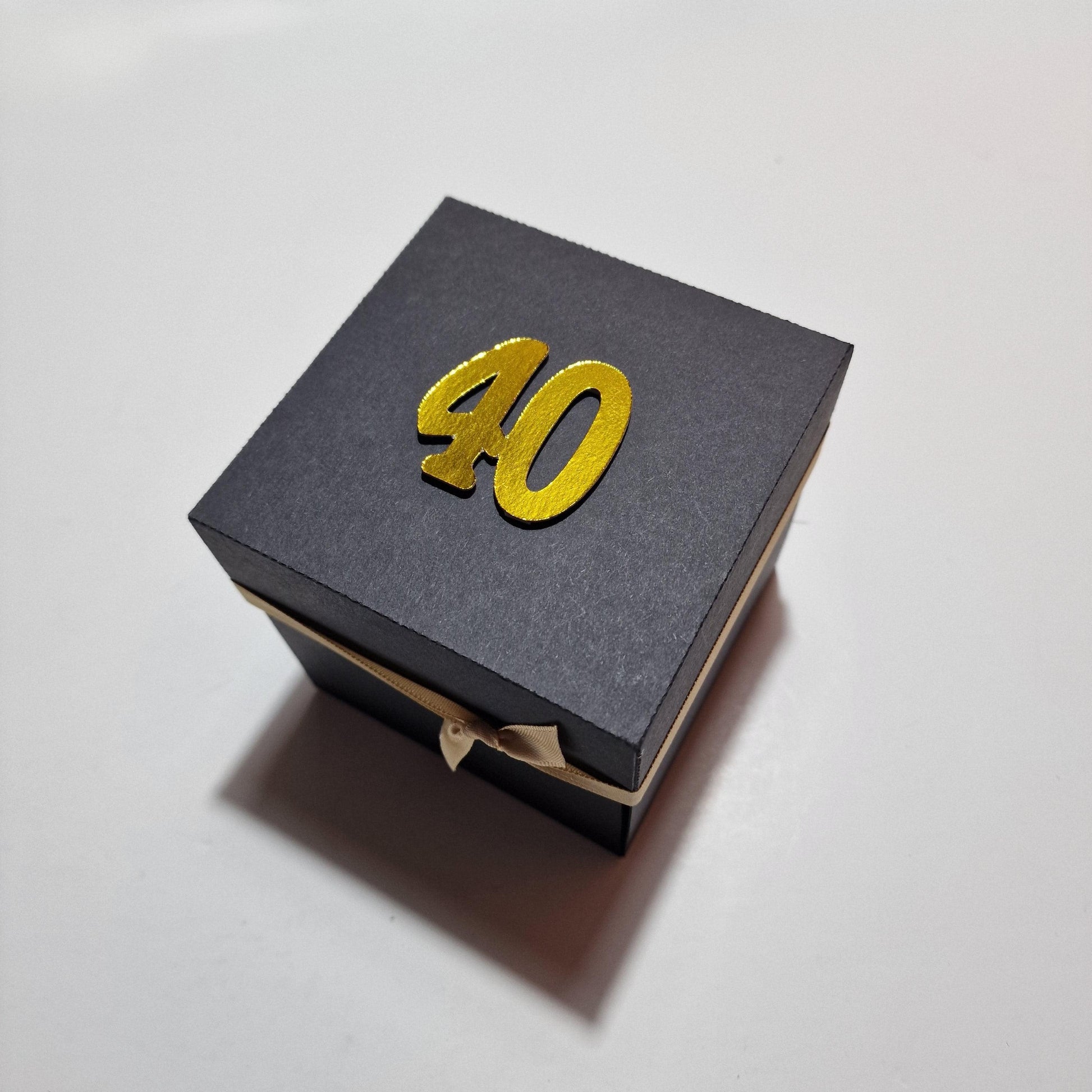 Exploding Trip Reveal Box - DUBROVNIK: A black box featuring gold numbers, designed as an exploding surprise trip reveal with intricate themed panels and personalized trip details for Dubrovnik.