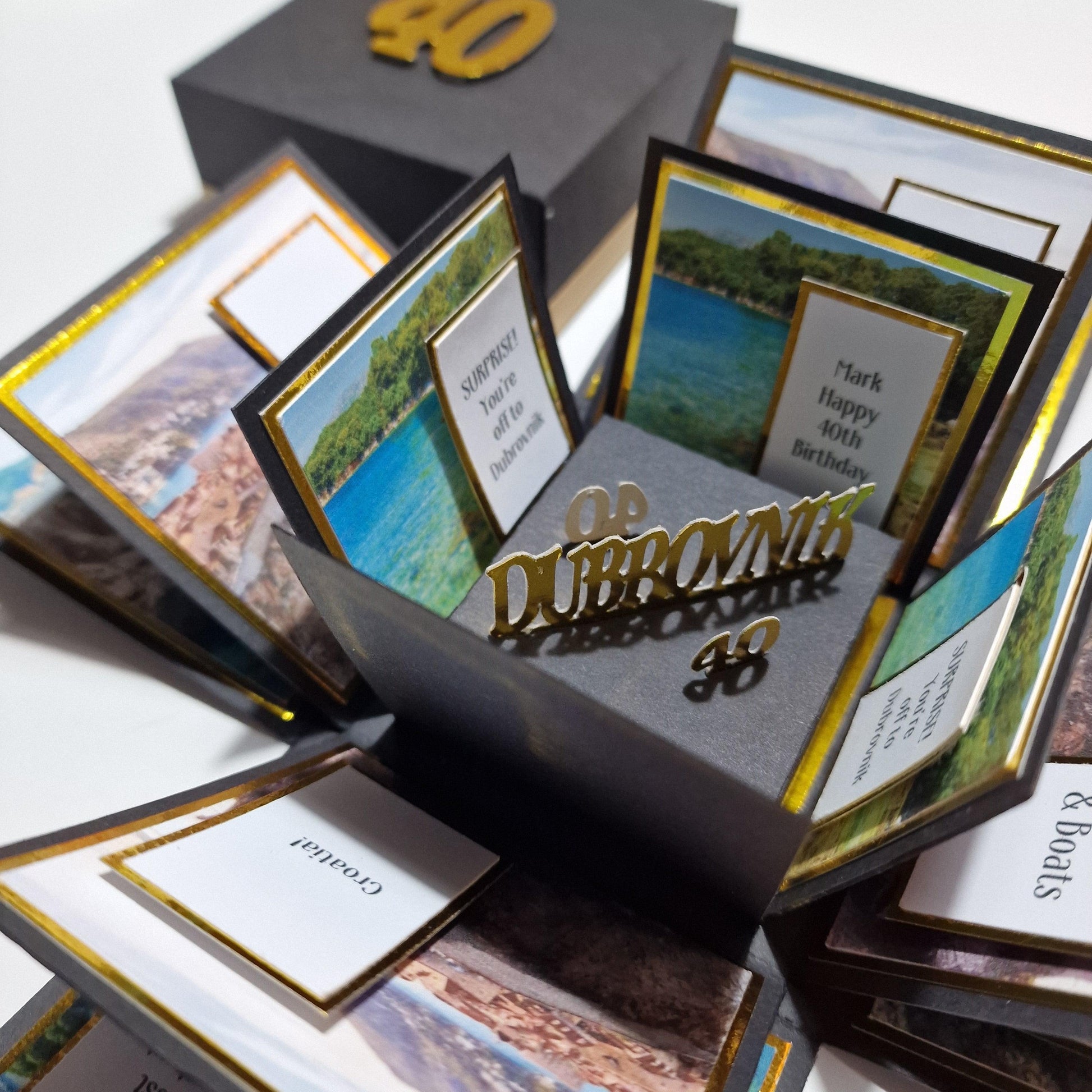 Exploding Trip Reveal Box - DUBROVNIK, featuring a pop-up design with themed landscape and architecture panels, including a central freestanding element, ideal for a surprise trip announcement.