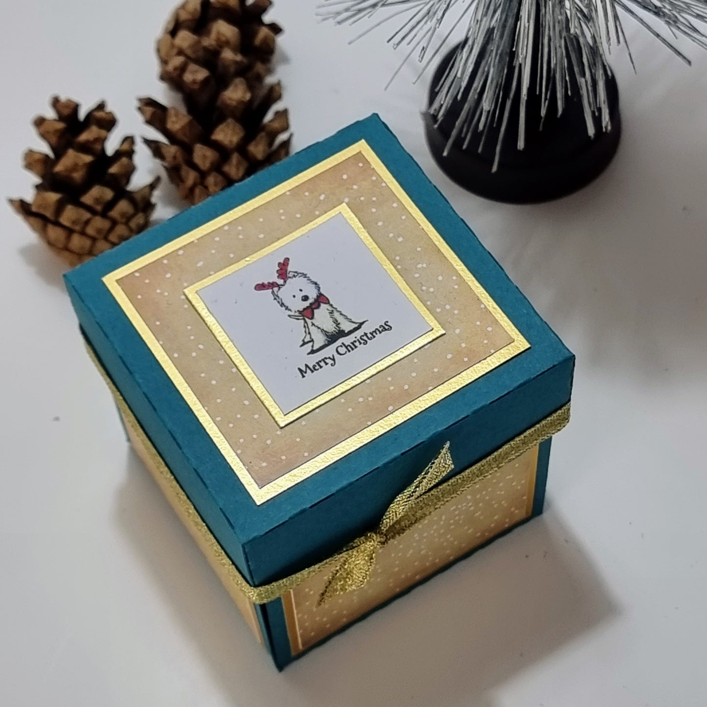 Green Box, cream snowy papers, west highland terrier in christmas antlers & greetings