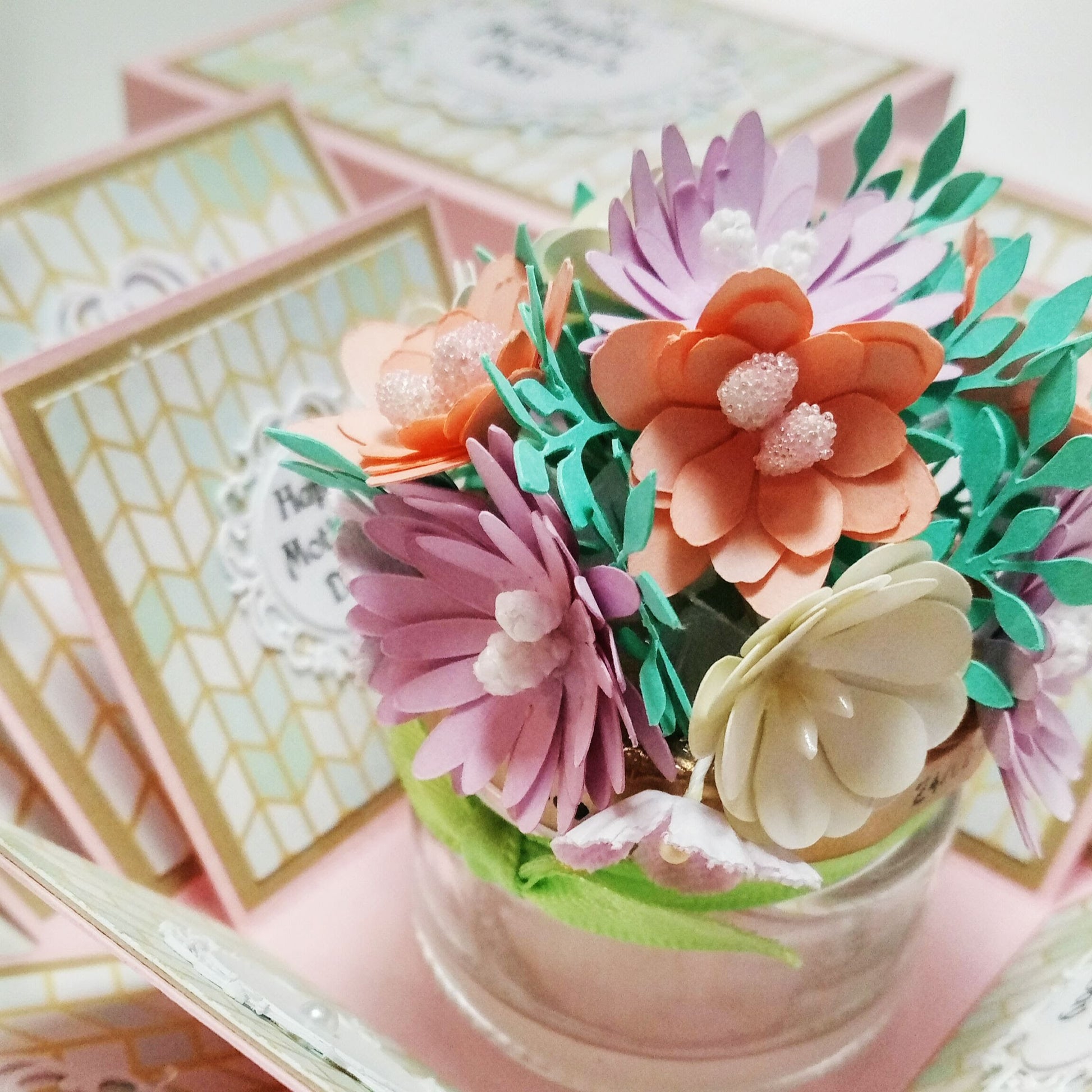 Mother's Day Forever Flower Bouquet Explosion Gift showcases a pop-open card with lifelike paper flowers, intricate embossed patterns, and decorative pink beads, perfect for memorable celebrations.