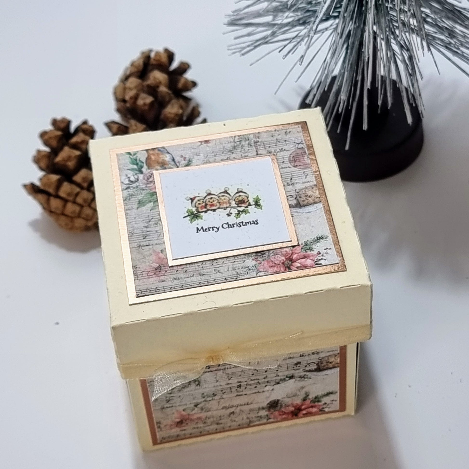 Cream box with christmas papers and Merry christmas greeting