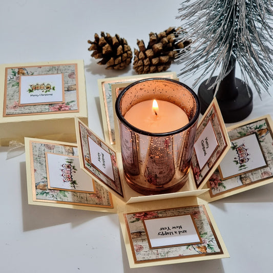 Cream box with christmas papers and Merry christmas greeting & Candle