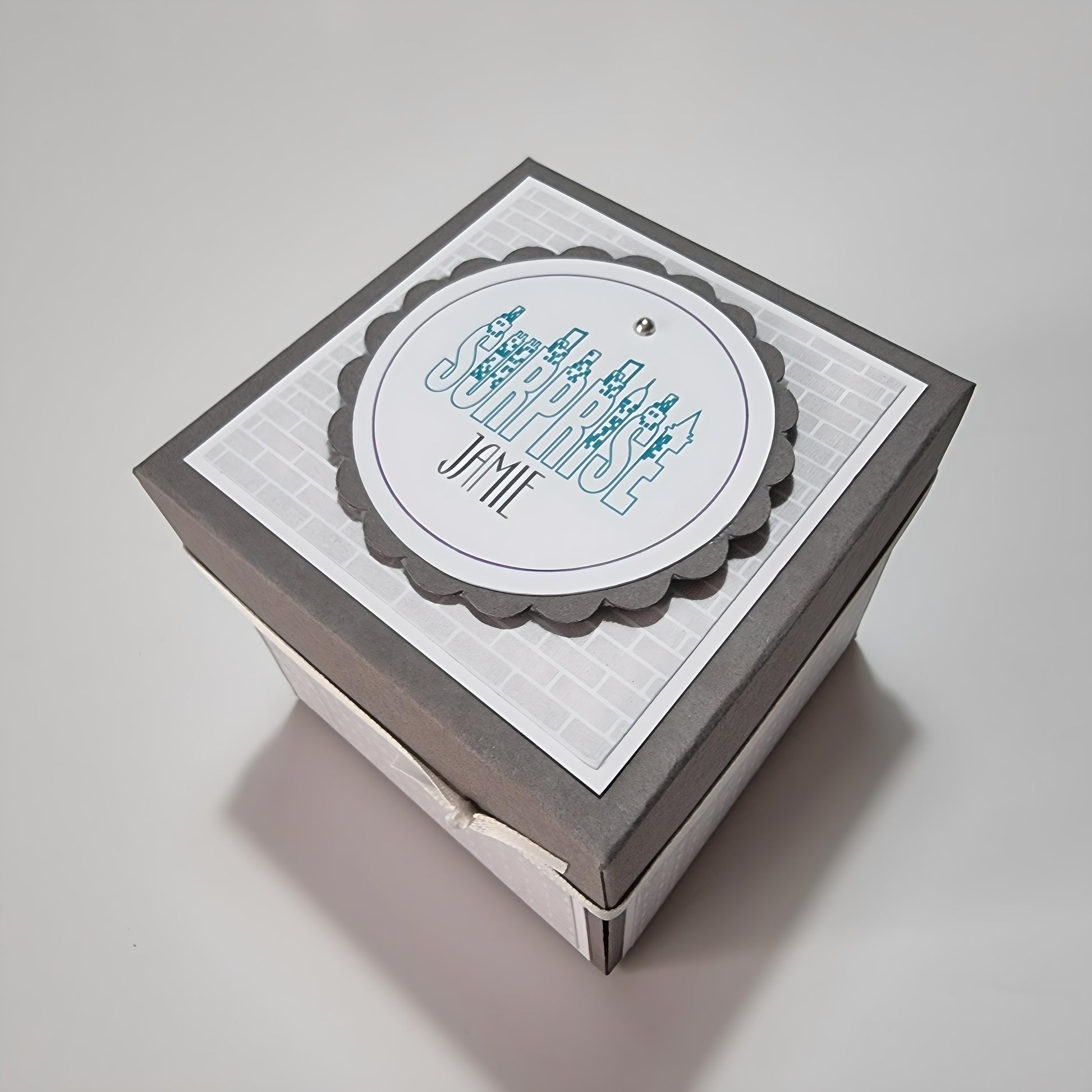 New York - Silver Grey Graffiti Styled - Surprise Special Occasion | Celebration Trip Reveal Explosion Box featuring a white circle on top with blue text and intricate New York-themed design elements.