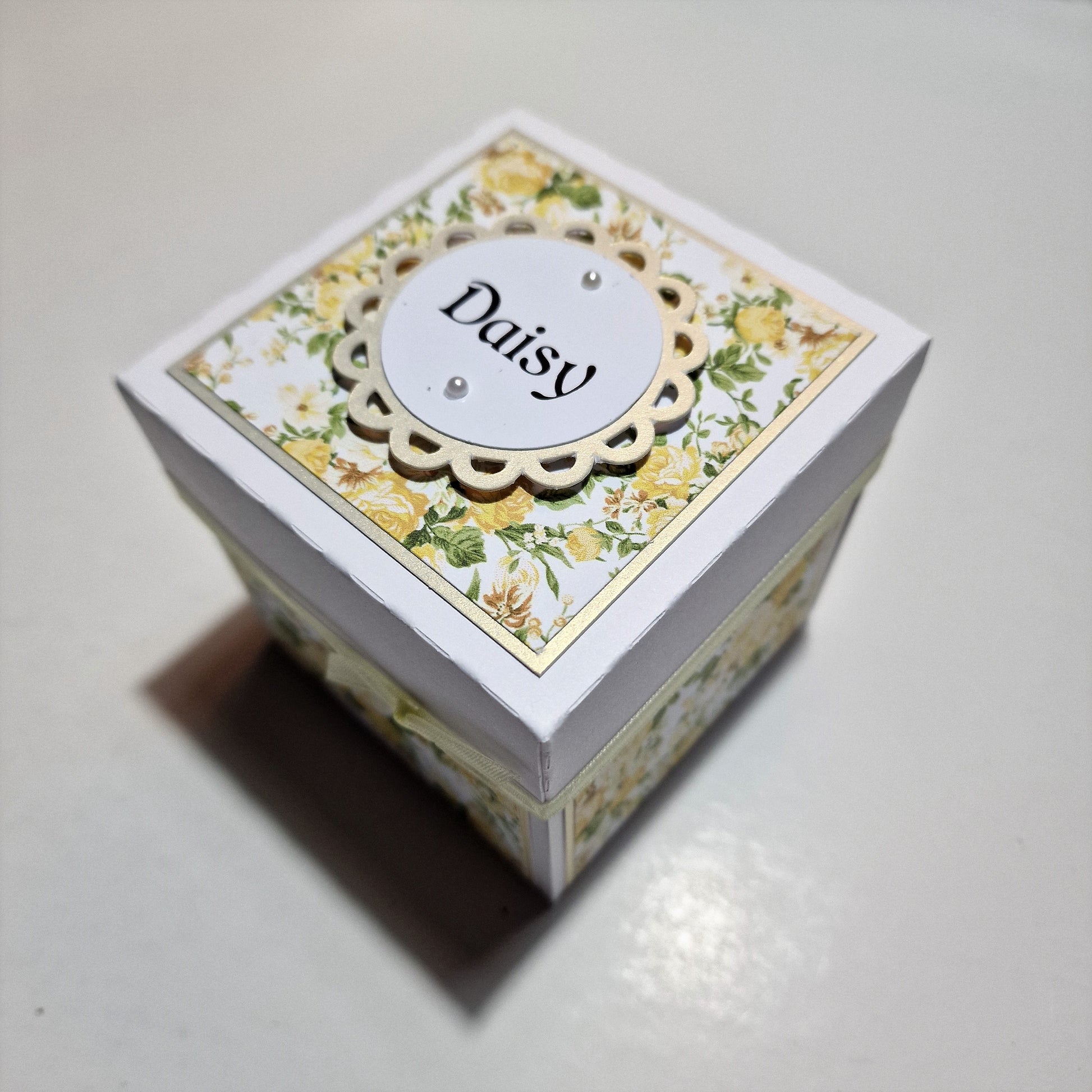 Yellow Roses Birthday Celebration Pop-Open Box Card featuring a closed box with a personalized label, showcasing intricate craftsmanship and floral embellishments, perfect for commemorating special milestones with elegance and charm.